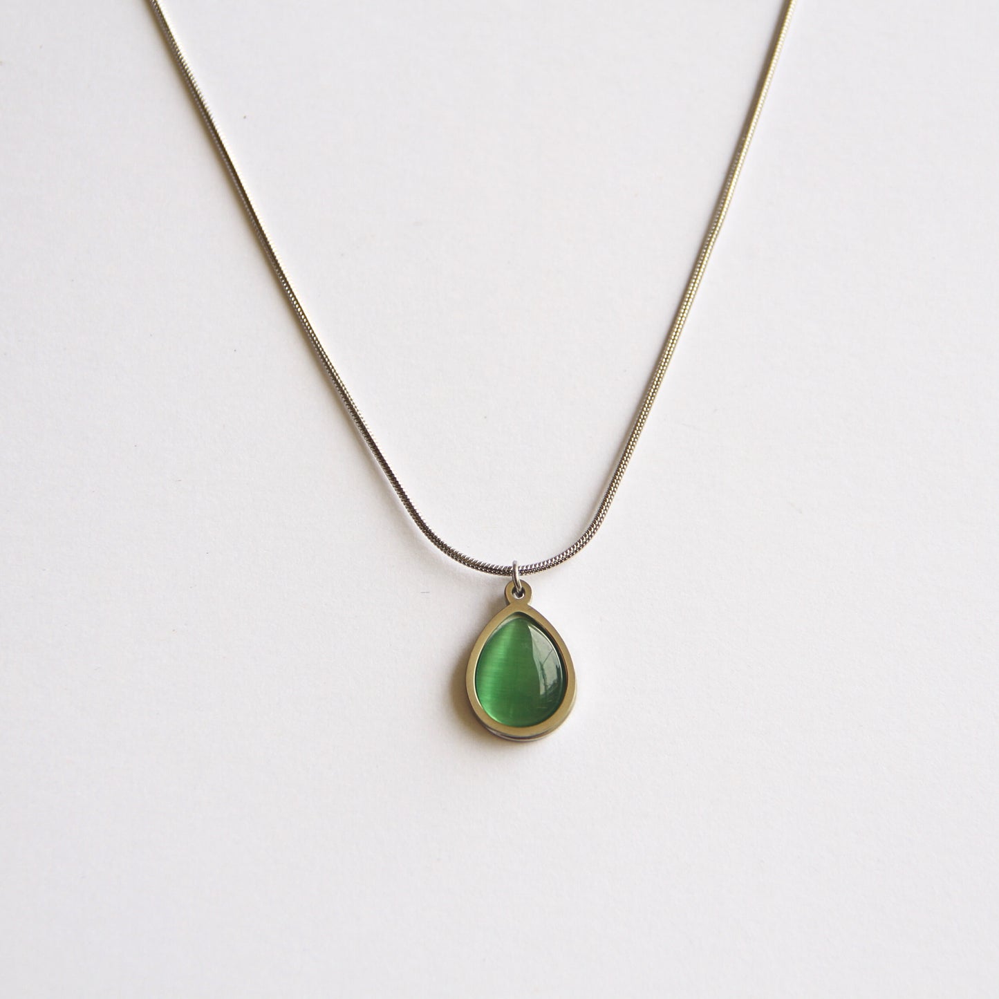 Minimalist Silver Tone Necklace with Luminous Green Teardrop Pendant