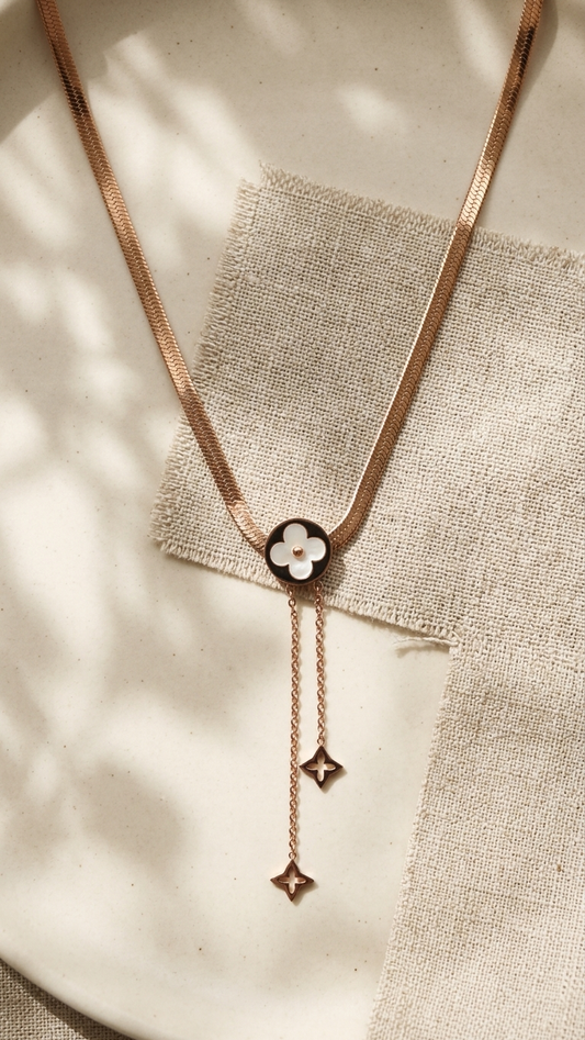 Chic Gold Tone Snake Chain Necklace with Clover Medallion & Dangles