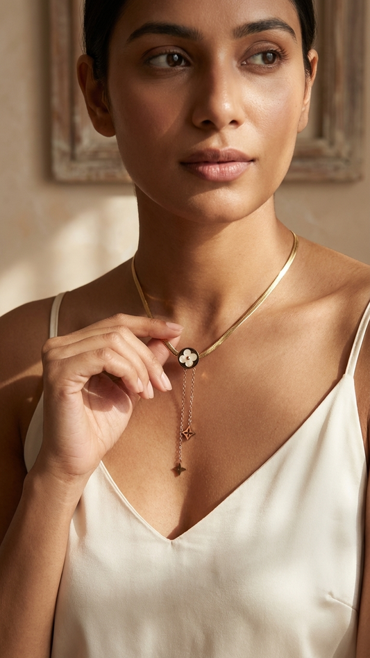 Chic Gold Tone Snake Chain Necklace with Clover Medallion & Dangles